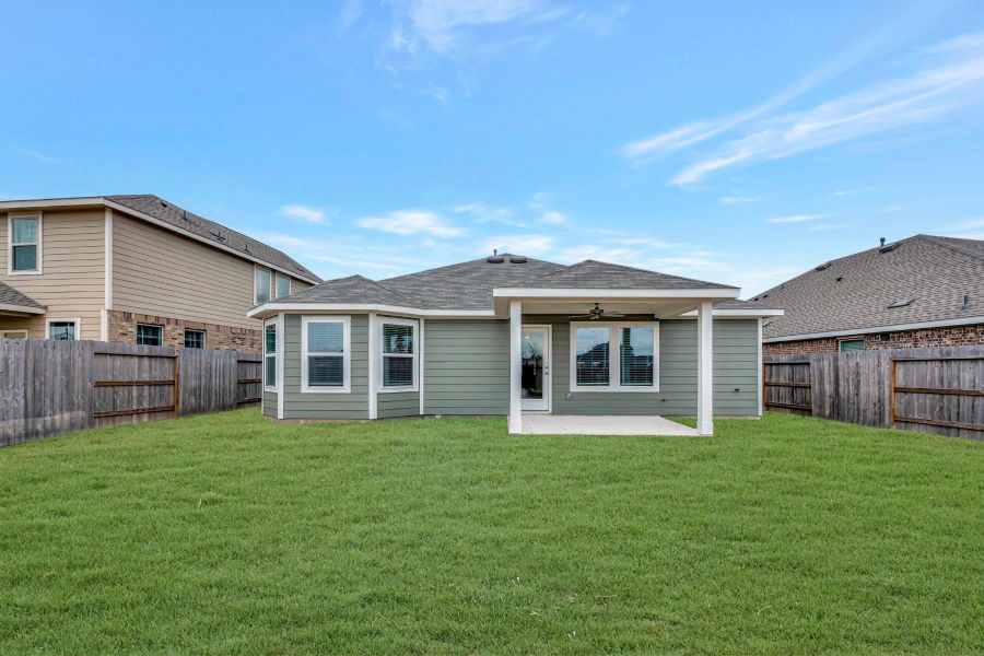 Exterior details and patio area of a home in Pinewood at Grand Texas, New Caney (Image 3).