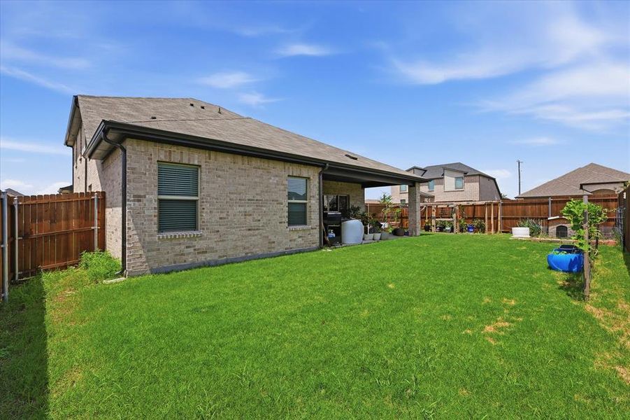 Exterior details and patio area of a home in Stonehaven, Seagoville (Image 4).