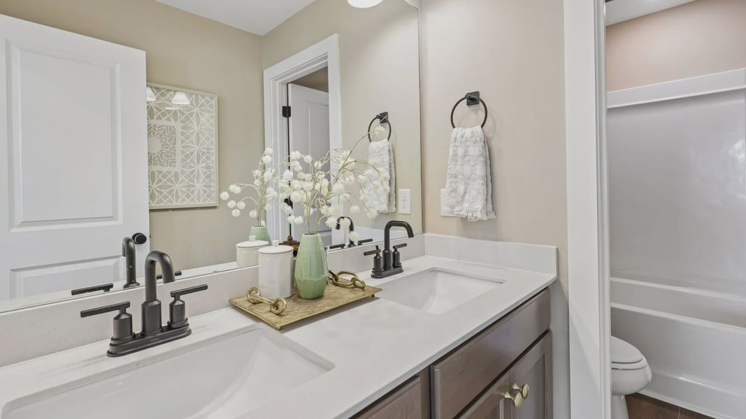 Secondary bathroom with dual vanity