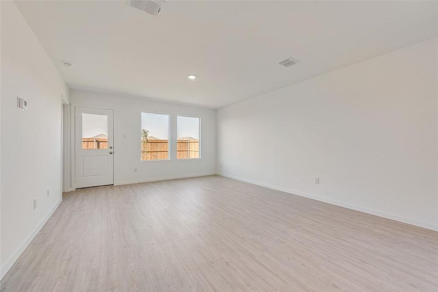 Spare room with light wood-type flooring