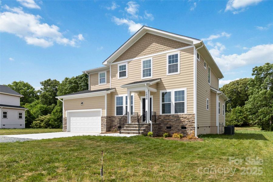 Front exterior of a new home in , Monroe, NC, highlighting curb appeal (Image 1).