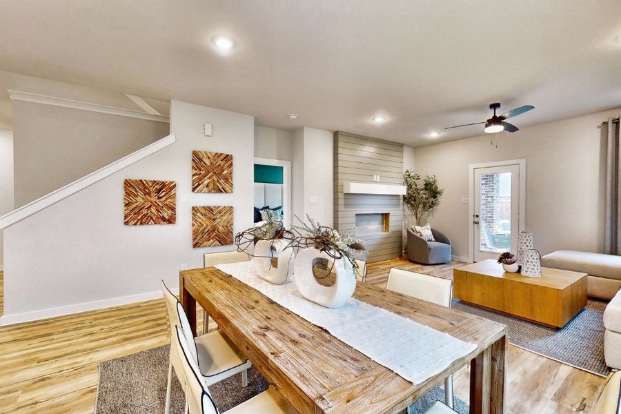 A living room with a dining table.