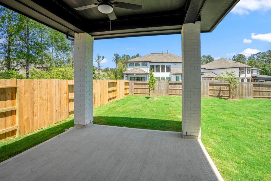 Exterior details and patio area of a home in ARTAVIA, Conroe (Image 32).