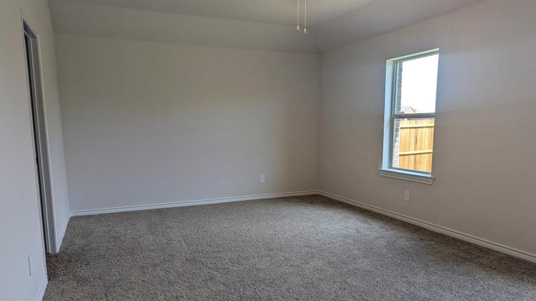 Unfurnished room featuring carpet flooring Unfurnished room featuring carpet flooring