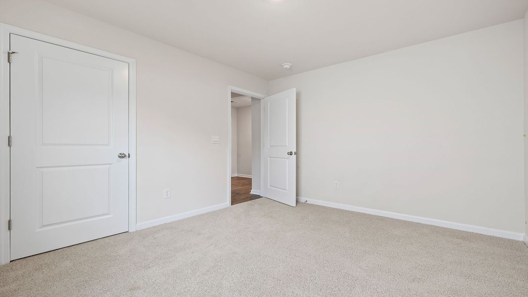 Spacious, unfurnished interior of a new home in Bentley Park, Greenwood (Image 19).