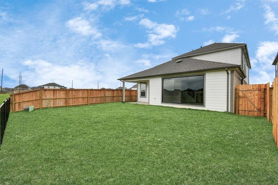 Come and see this spacious backyard with its beautiful covered patio. There is plenty of room for the kids to play and adults to relax. Perfect for your outdoor living space, patio furniture, bbq pit, and so much more. The possibilities are endless!