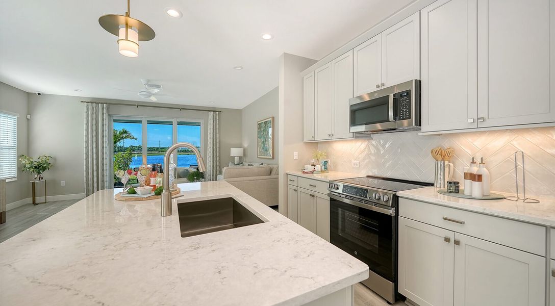 Representative furnished interior of a home built from the Parker by Neal Communities in SkySail, Naples (Image 14).