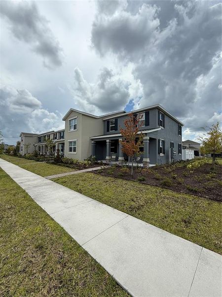 Front exterior of a new home in , Orlando, FL, highlighting curb appeal (Image 21). Front exterior of a new home in , Orlando, FL, highlighting curb appeal (Image 21).