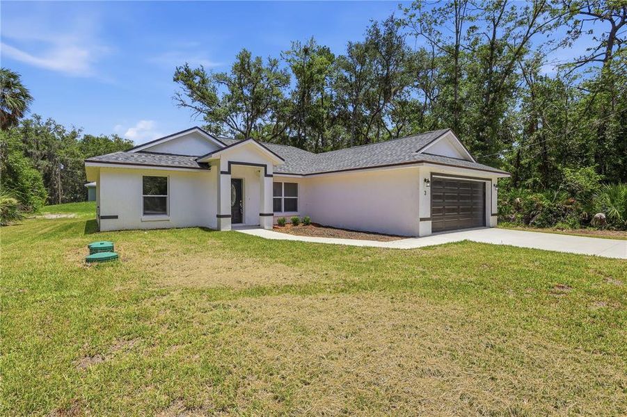 Front exterior of a new home in , Ocklawaha, FL, highlighting curb appeal (Image 24). Front exterior of a new home in , Ocklawaha, FL, highlighting curb appeal (Image 24).