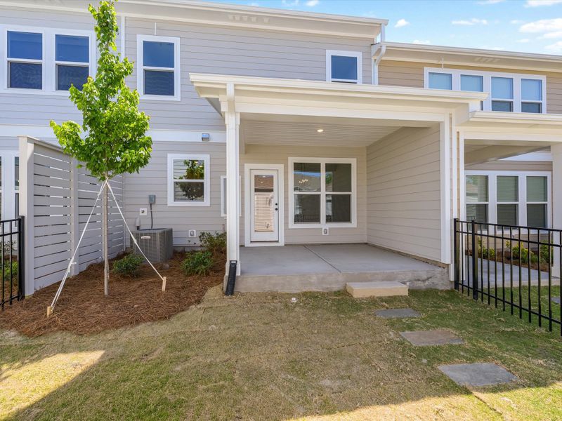Exterior details and patio area of a home in North Creek Village - Townhomes, Huntersville (Image 3).