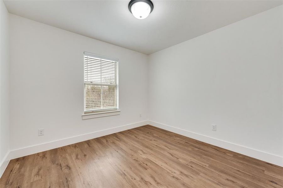 Empty room featuring light wood-type flooring