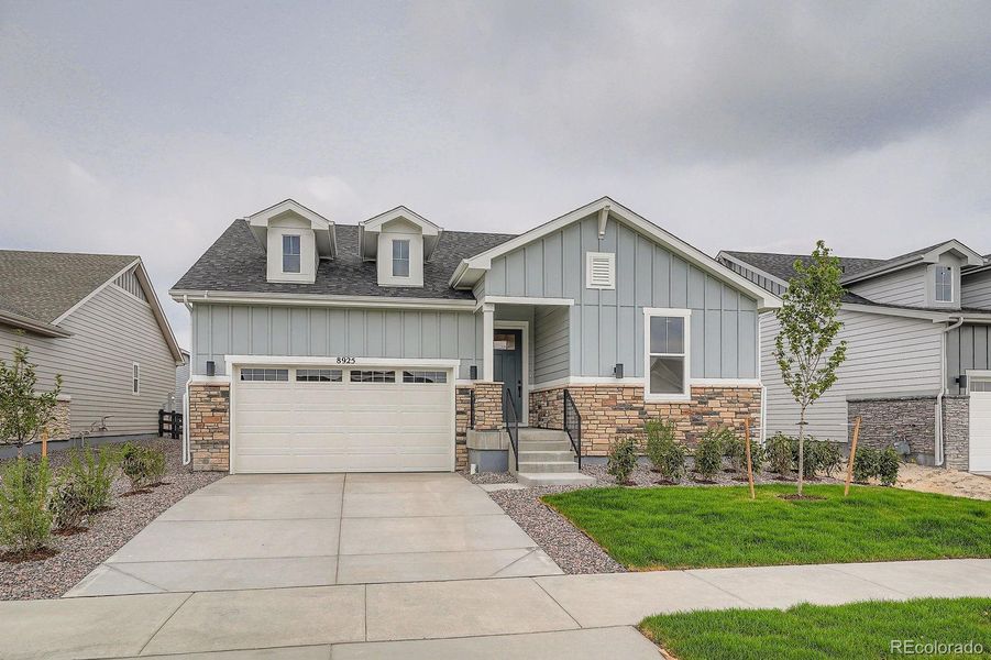 Front exterior of a new home in Hilltop 55+ at Inspiration 55s, Aurora, CO, highlighting curb appeal (Image 18).