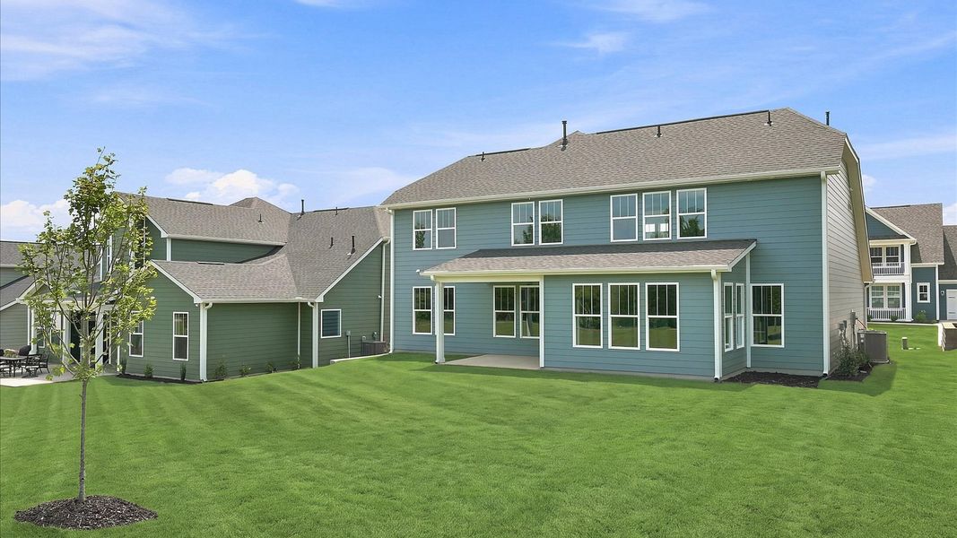 Tasteful rear porch provides a peaceful retreat and effortless indoor-outdoor flow