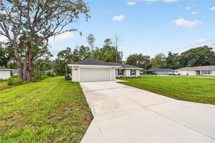 Front exterior of a new home in , Ocala, FL, highlighting curb appeal (Image 21). Front exterior of a new home in , Ocala, FL, highlighting curb appeal (Image 21).