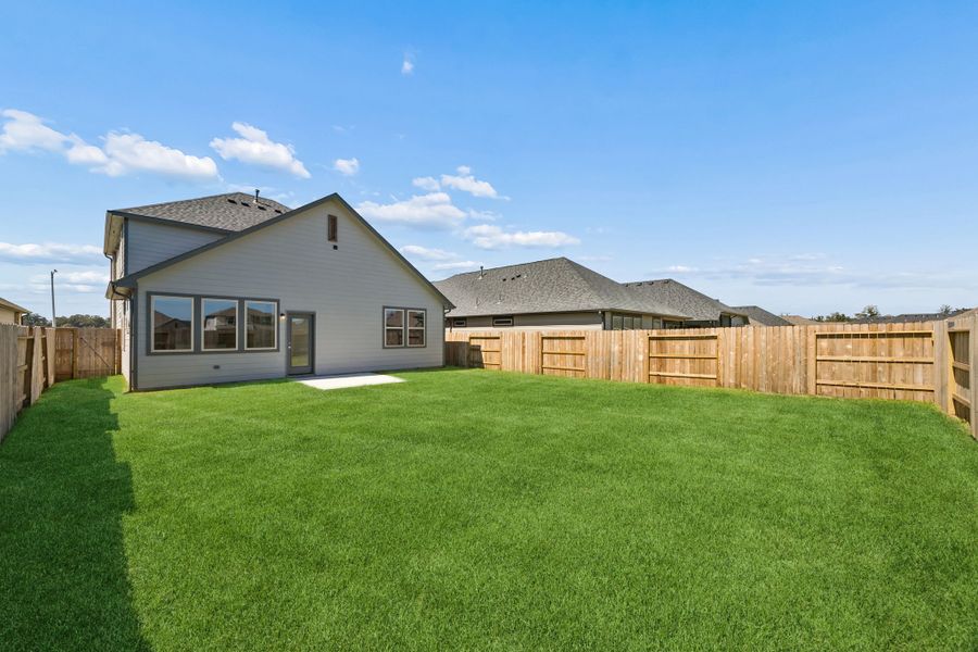 Exterior details and patio area of a home in Riviera Pines, Huffman (Image 22).