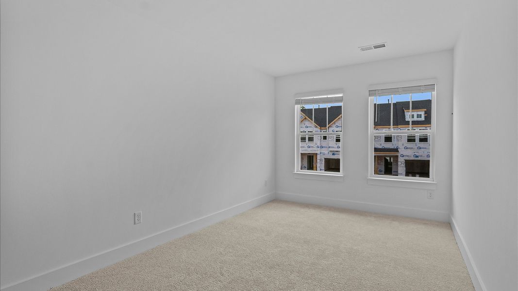 Refined bedroom design with large windows for daylight-filled mornings and peaceful views Refined bedroom design with large windows for daylight-filled mornings and peaceful views