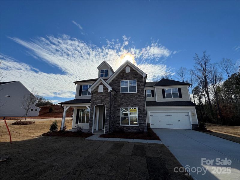 Front exterior of a new home in Carrington, Stanley, NC, highlighting curb appeal (Image 17).