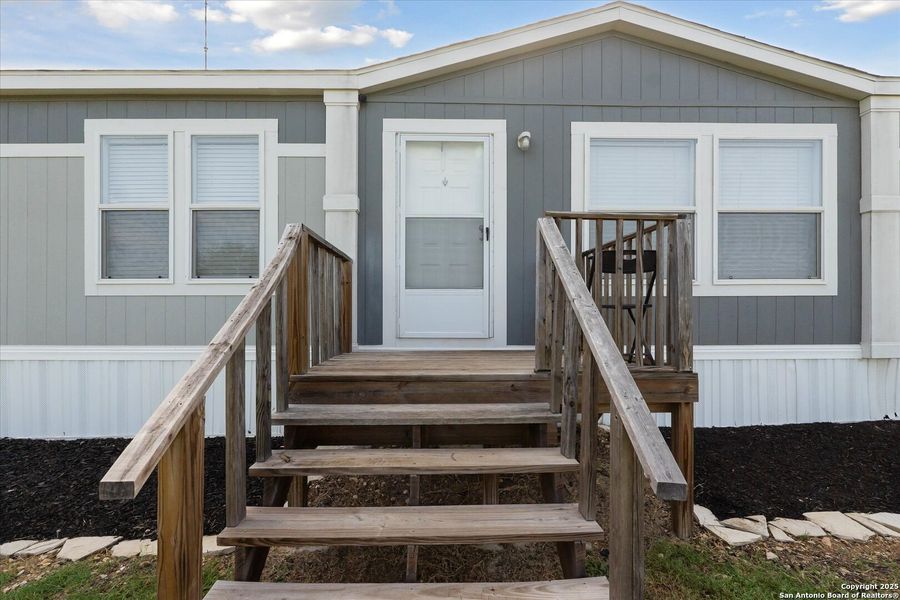 Front exterior of a new home in , Somerset, TX, highlighting curb appeal (Image 20). Front exterior of a new home in , Somerset, TX, highlighting curb appeal (Image 20).