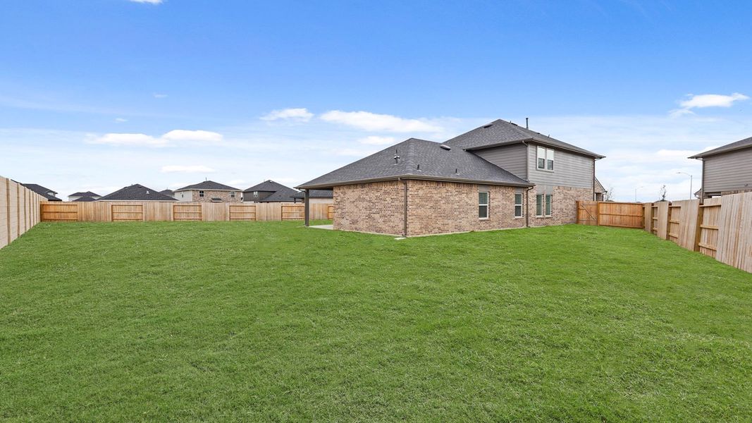 Exterior details and patio area of a home in Sunterra, Katy (Image 3).