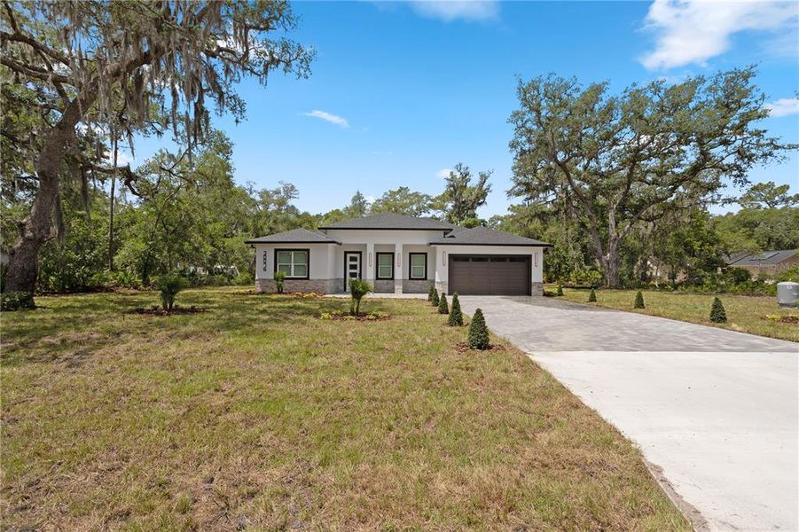 Front exterior of a new home in , Eustis, FL, highlighting curb appeal (Image 26).