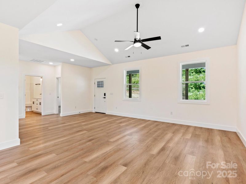 Off the living room is a hall with 2 guest bedrooms, laundry room & primary w/ on suite.  All on one level.