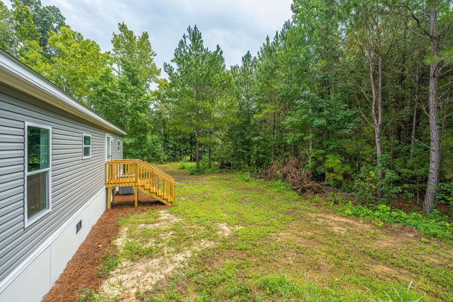 Exterior details and patio area of a home in , Cottageville (Image 32).