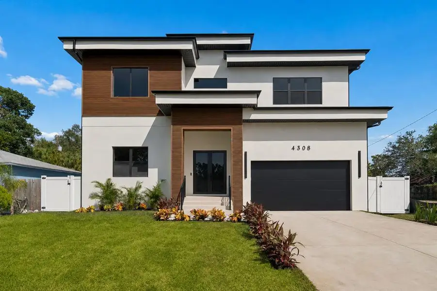 Front exterior of a new home in , Tampa, FL, highlighting curb appeal (Image 1). Front exterior of a new home in , Tampa, FL, highlighting curb appeal (Image 1).