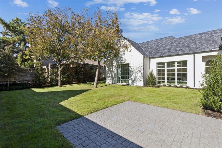 View of green lawn featuring a patio area