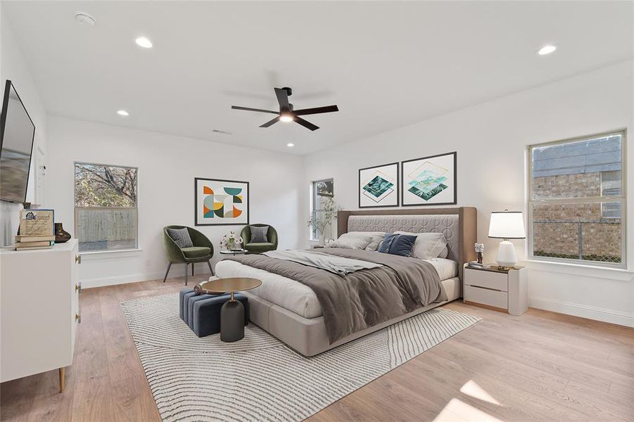 Bedroom with ceiling fan, multiple windows, and light hardwood / wood-style flooring