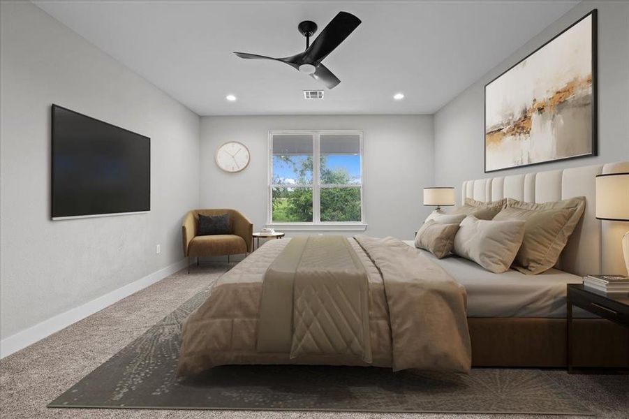 Carpeted bedroom featuring recessed lighting and a ceiling fan