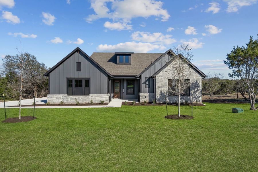 Representative exterior photo of a completed home built from the The Rockmoor by David Weekley Homes in Rees Landing Estates, Spicewood, TX (Image 1).