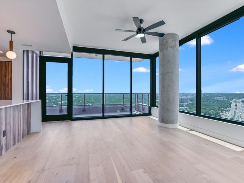 Corner unit with floor to ceiling windows throughout.