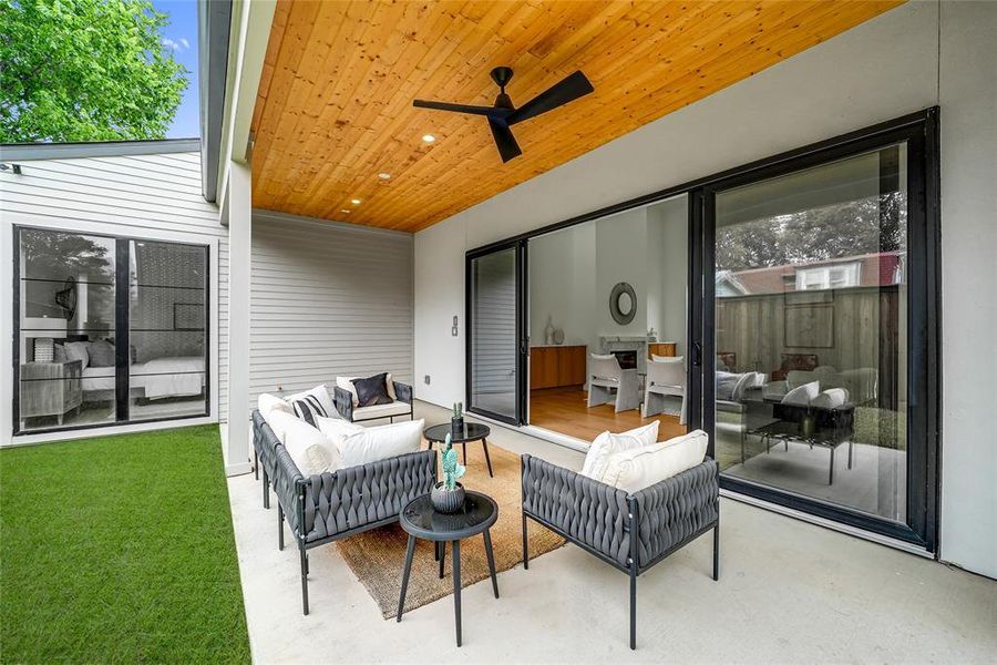 Covered patio featuring a wood-finish ceiling with recessed lighting and a ceiling fan