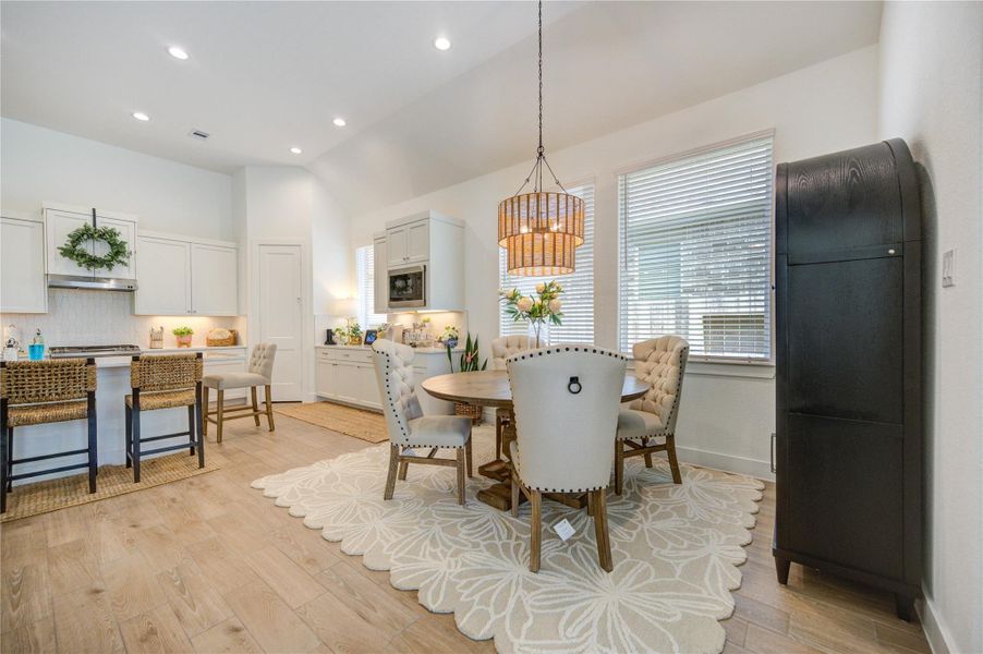 The dining area connects beautifully to the surrounding living spaces, creating an open and inviting feel. The dining area connects beautifully to the surrounding living spaces, creating an open and inviting feel.