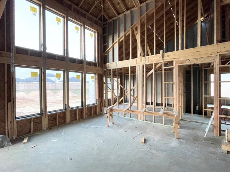 Family Room Masterpiece Showcasing High Ceilings & Designer Charm
