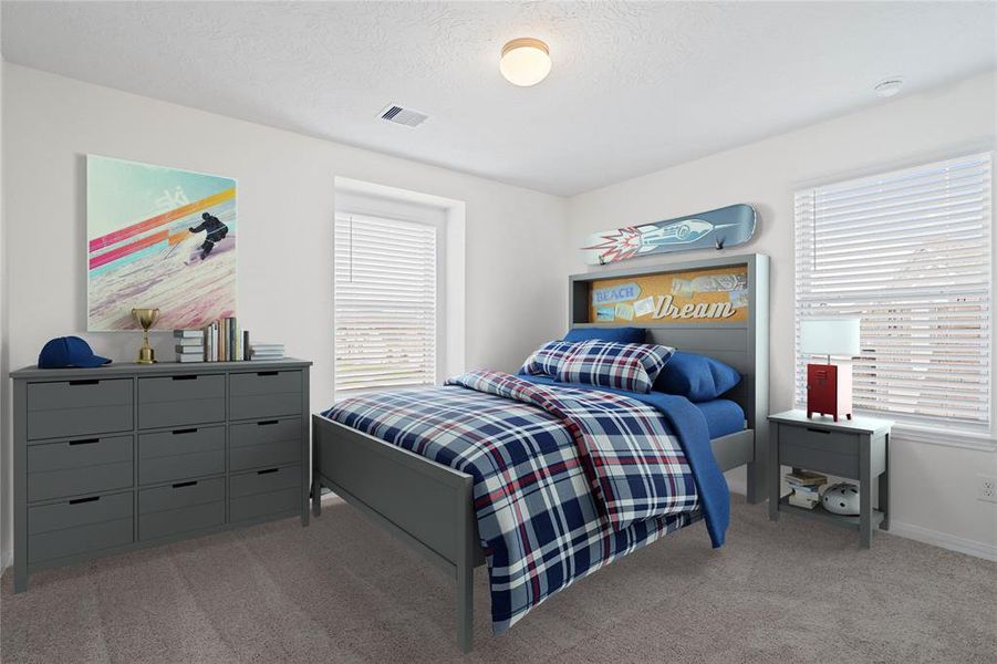 Secondary bedroom features plush carpet, neutral paint, lighting, large windows with privacy blinds and ample sized closet space.