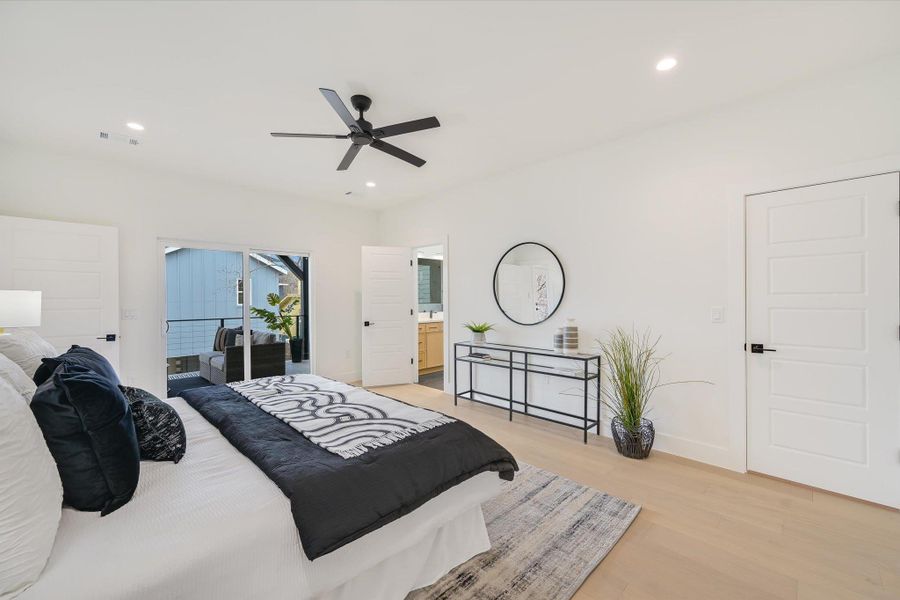 This angle showcases the generous proportions of the primary suite, leading seamlessly into the spa-like bathroom.