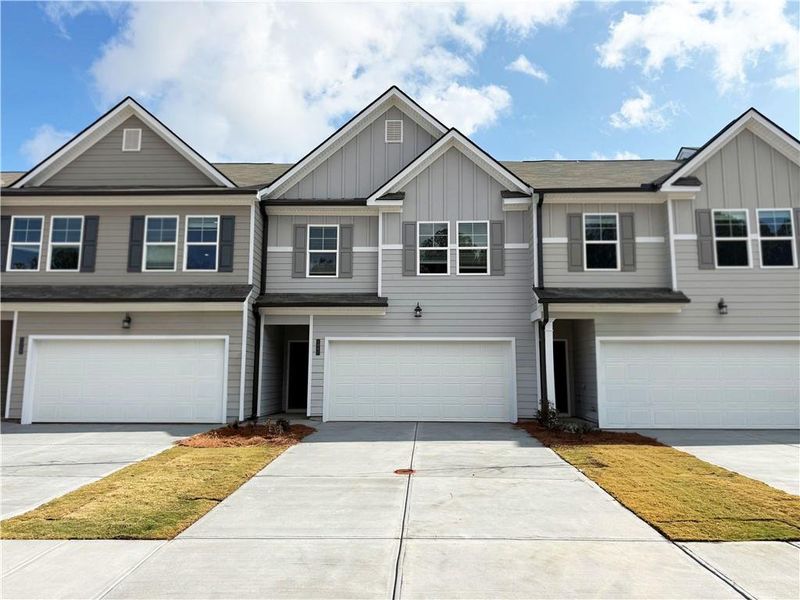 Front exterior of a new home in Rivershire Place, Villa Rica, GA, highlighting curb appeal (Image 1). Front exterior of a new home in Rivershire Place, Villa Rica, GA, highlighting curb appeal (Image 1).