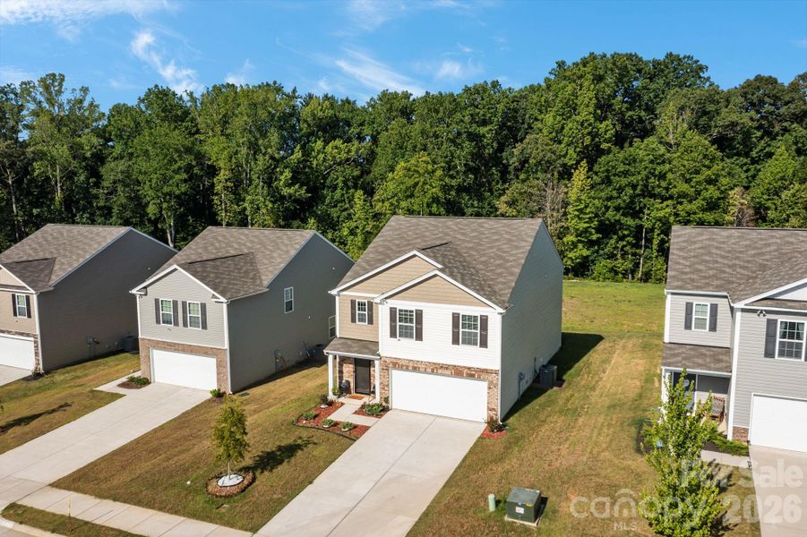Front exterior of a new home in Mills at Long Creek, Dallas, NC, highlighting curb appeal (Image 20).