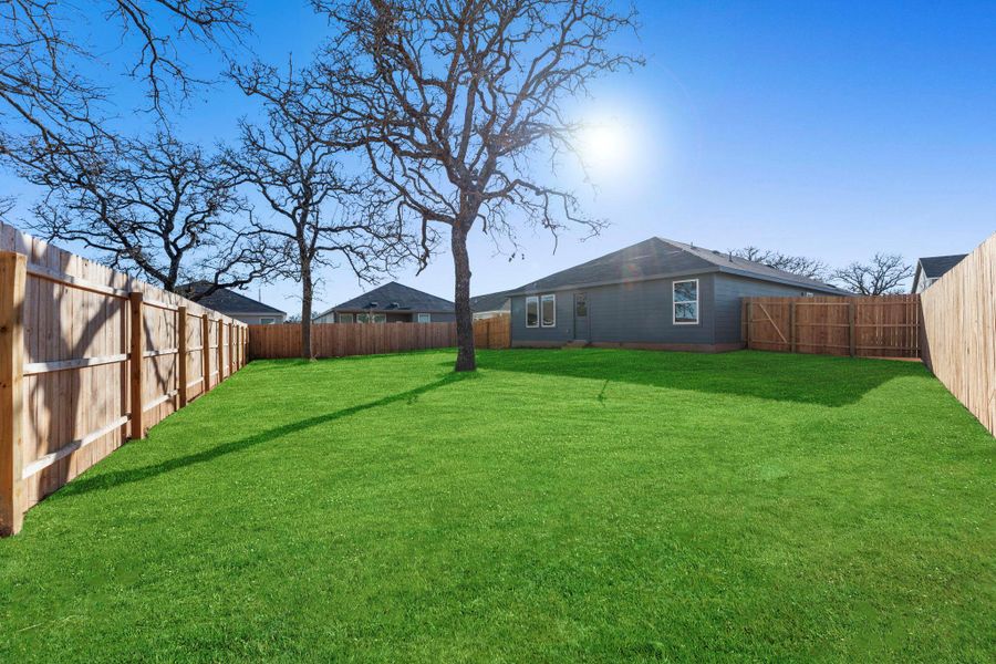 Exterior details and patio area of a home in Friendship Oaks, Fredericksburg (Image 2).