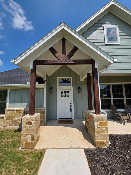 Front exterior of a new home in , Springtown, TX, highlighting curb appeal (Image 19).