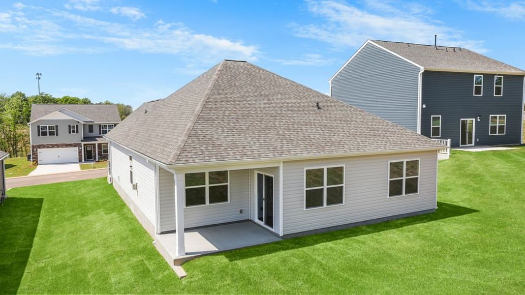 Exterior details and patio area of a home in Durbin Meadows Traditions, Fountain Inn (Image 4).