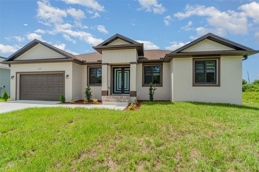 Front exterior of a new home in , Port Charlotte, FL, highlighting curb appeal (Image 21).