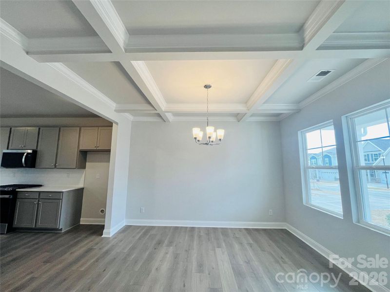Dining area with coffered ceiling detail