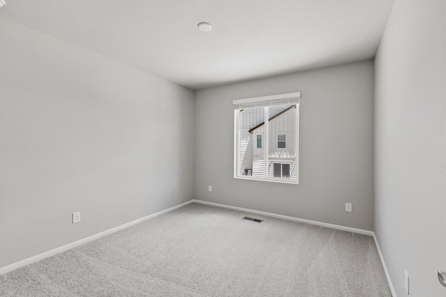 Spacious, unfurnished interior of a new home in Woodrose at Painted Prairie, Aurora (Image 17).