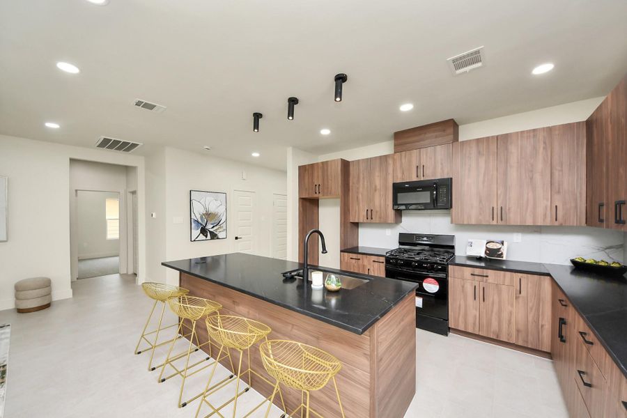Custom soft-close cabinetry and drawers provide a quiet, high-end feel.