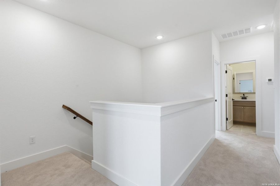 Spacious, unfurnished interior of a new home in Enchanted Bluff, San Antonio (Image 38).