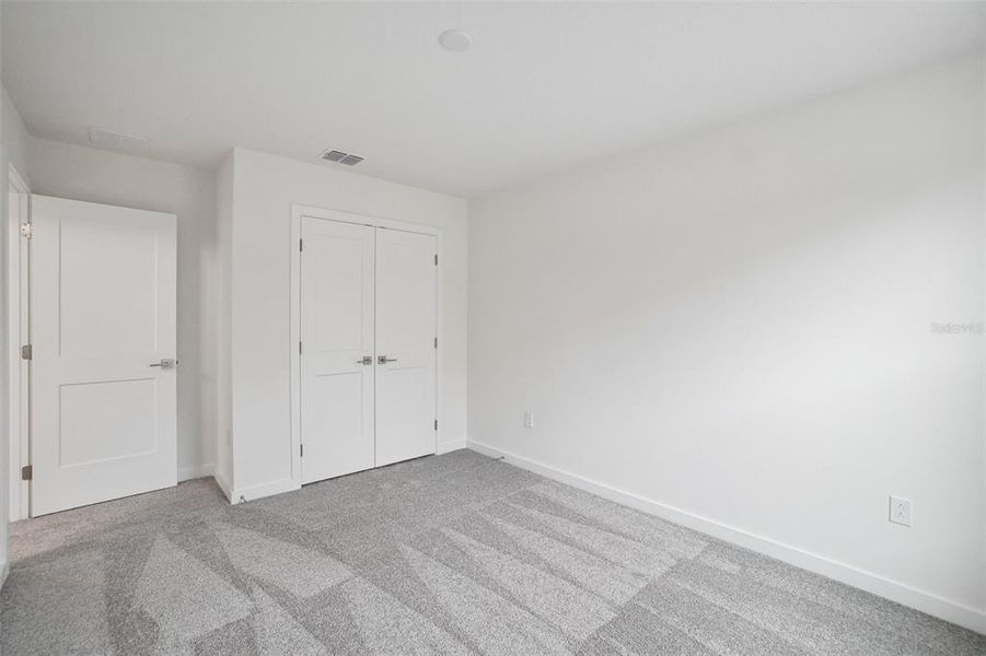 Spacious, unfurnished interior of a new home in Grasslands West, Lakeland (Image 41).
