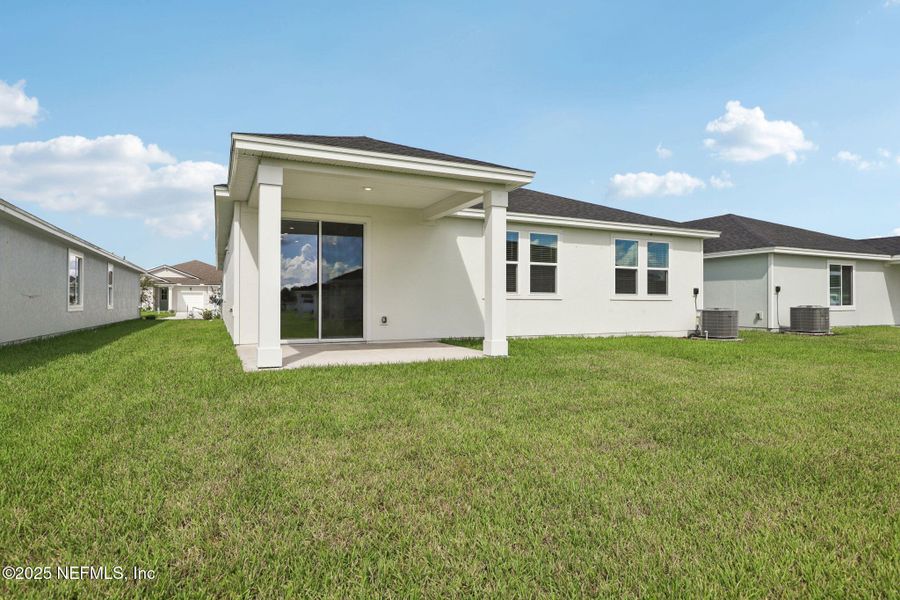 Exterior details and patio area of a home in Lakes at Bella Lago - Signature Series, Green Cove Springs (Image 21).