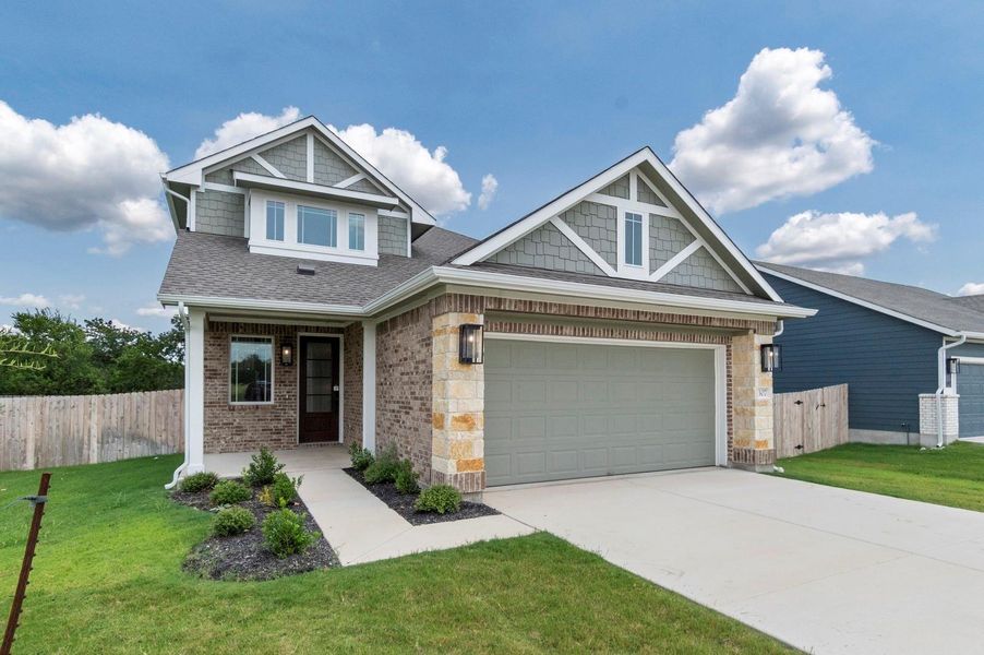 Front exterior of a new home in Grande Estates, Bertram, TX, highlighting curb appeal (Image 26). Front exterior of a new home in Grande Estates, Bertram, TX, highlighting curb appeal (Image 26).
